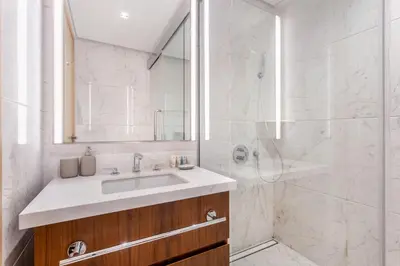 a bathroom with a sink and a shower at Modern Comfort1BR RP Heights 5-min Dubai Mall in Dubai