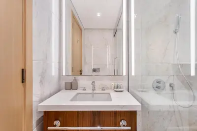 a bathroom with a sink and a shower at Modern Comfort1BR RP Heights 5-min Dubai Mall in Dubai