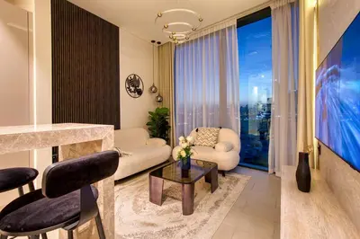 a living room with a couch and a table at Apartment 1015 Waves in Dubai
