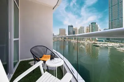 a balcony with a view of a body of water at Marina Elegance, Your Dream Dubai Marina Stay in Dubai
