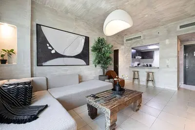 a living room with a couch and a table at Marina Elegance, Your Dream Dubai Marina Stay in Dubai