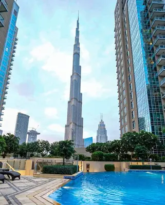 a view of the burj khalifa from the pool in the city at Elite Royal Apartment - Sky Series - Breathtaking View - Full Burj Khalifa & Fountain in Dubai