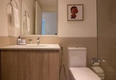 a bathroom with a sink and a toilet and a mirror at Offer! 1BR, Skyline View, Dubai Hills Estate, Park Ridge in Dubai