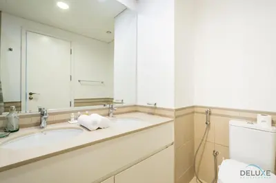 a bathroom with a sink and a mirror at Delightful 2BR Apartment in Town Square Safi 1A, Dubailand by Deluxe Holiday Homes in Dubai