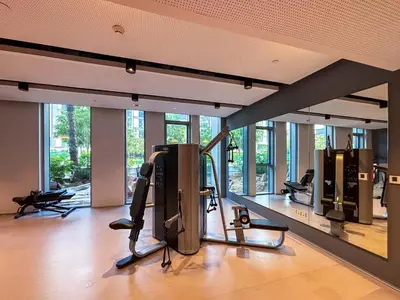 a gym with treadmills and ellipticals in a building at Frank Porter - Bluewaters Residences Building 5 in Dubai
