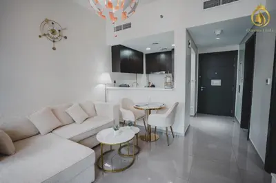 a living room with a couch and a table at Queens Estate Vacation Homes - Merano Tower, Business Bay in Dubai