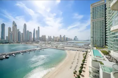 a view of aiami beach with a bridge and buildings at Spacious 2 BHK next to the Beach - Sunrise Bay in Dubai
