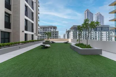 an apartment rooftop with a green lawn at Wilton Terraces T1 - 1BR Apartment - Allsopp&Allsopp in Dubai