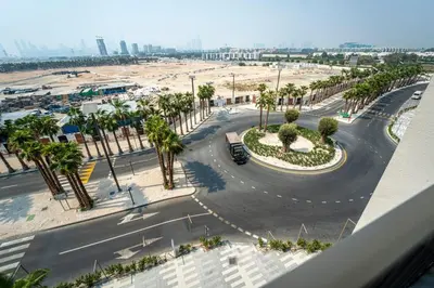 an aerial view of a street with palm trees at AWS Holiday Homes - Chic Downtown Views in Dubai