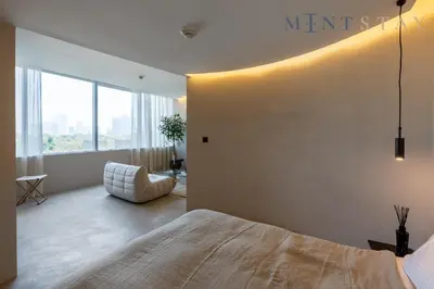 a bedroom with a large bed and a large window at Sky Gardens, Park Avenue, DIFC - Mint Stay in Dubai
