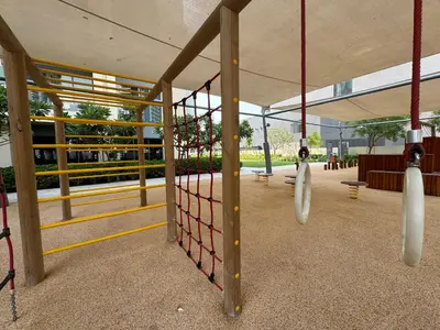 an empty playground with swings in a building at Burj Royale Condo, Close to Dubai Mall & Attractions in Dubai
