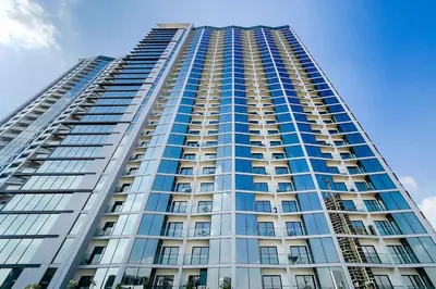 a tall building with a lot of windows at Apartment 816 Sobha Waves in Dubai