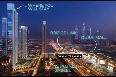 a view of a city at night with buildings at Elegant - 1BR - 8 MIN Burj Khalifa & Dubai Mall in Dubai