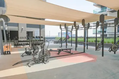 a gym with bikes on a bike rack in a building at Waves - Comfort and Style in a 21st-Floor Studio With View in Dubai