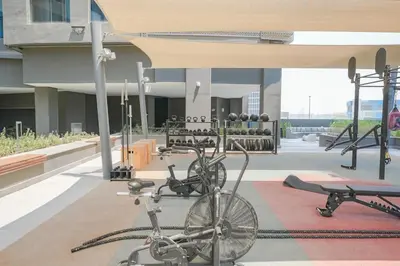 two bikes parked in a gym with weights at Waves - Comfort and Style in a 21st-Floor Studio With View in Dubai