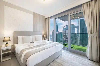 a bedroom with a large bed and a large window at SmartStay at Opera Grand - Stunning Burj Khalifa Views - Brand New Luxury Residences in Dubai