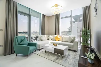 a living room with a couch and two chairs at Your Keys Holiday Homes in Dubai