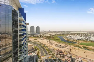 a view of a city from a building at Tranquil Studio with Golf View in Dubai