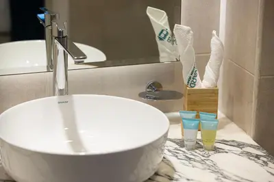 a bathroom with a sink and a counter with a sink at Boulevard 2 Bedroom Family Apartment with BURJ KHALIFA view and INFINITY POOL in 64th Floor Dubai Downtown in Dubai