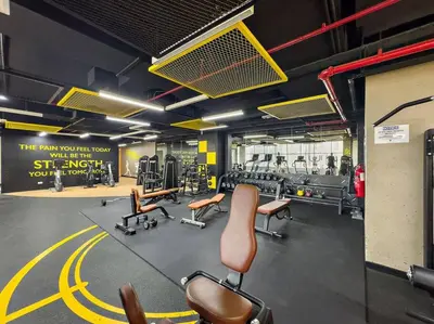 a gym with chairs and equipment in a room at Renovated Studio next to Dubai Mall & Burj Khalifa in Dubai
