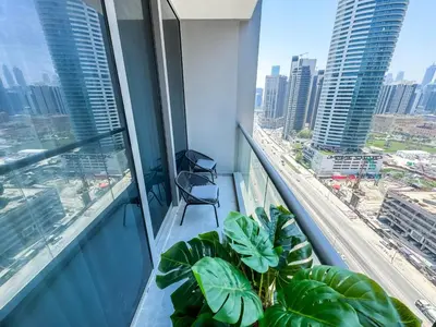 a balcony in a building with a view of a city at High Floor Burj Khalifa View 1BR - Business Bay in Dubai