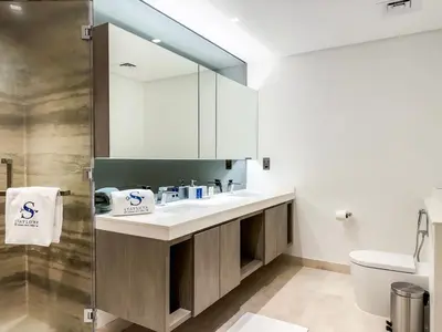 a bathroom with a sink and a mirror at High Floor Burj Khalifa View 1BR - Business Bay in Dubai