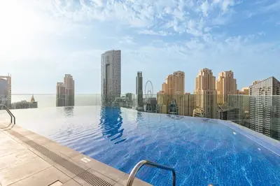 a large swimming pool on the roof of a building at Condor Marina Star, Dubai Marina by SIMPLY COMFORT in Dubai