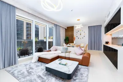 a living room with a couch and a table at Globalstay Creek Horizon Modern Apartments in Dubai