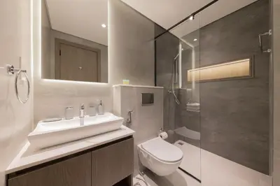 a bathroom with a sink and a toilet and a shower at Shining studio in Laya Heights in Dubai