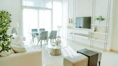 a living room with a couch and a table at New Elegance at Burj Crown downtown Balcony & View in Dubai