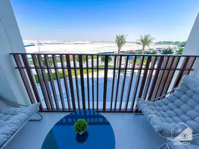 a balcony with chairs and a view of the beach at Amazing stay at Dubai creek with Balcony & View in Dubai