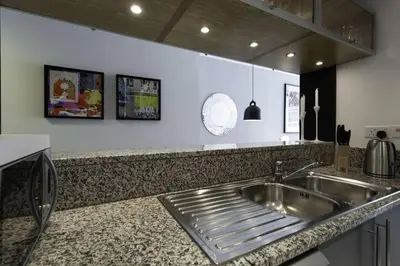 a kitchen with a sink and a counter top at Dubai Marina Walking distance to metro Marina View in Dubai