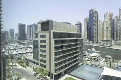 a tall building with a marina in a city at Dubai Marina Walking distance to metro Marina View in Dubai