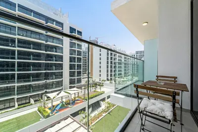 a balcony with a view of a building at Silkhaus Luxurious Studio in High End Neighborhood in Dubai