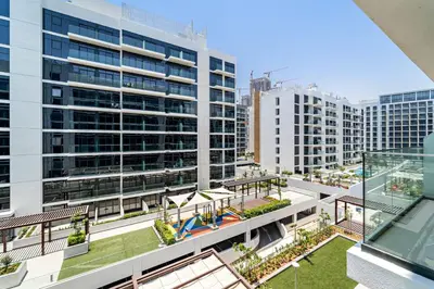 an aerial view of a large building with a pool at Silkhaus Luxurious Studio in High End Neighborhood in Dubai
