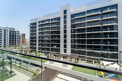 a large building with a picnic table in front of it at Silkhaus Luxurious Studio in High End Neighborhood in Dubai