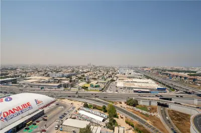 an aerial view of a city with a highway at Frank Porter - Aykon City Tower in Dubai