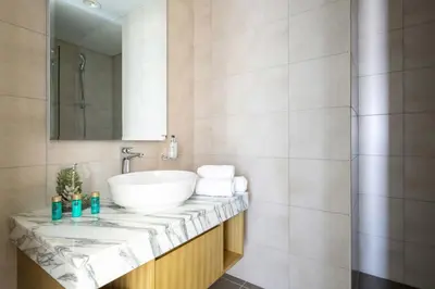 a bathroom with a sink and a mirror at Frank Porter - Aykon City Tower in Dubai