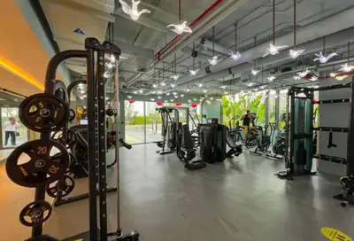 a gym with lots of treadmills and machines at City Retreat MAG 318,Downtown Dubai 5 minutes walk to Dubai mall in Dubai