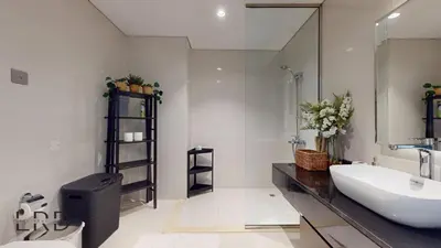 a bathroom with a sink and a large mirror at Luxury Studio in Business Bay in Dubai