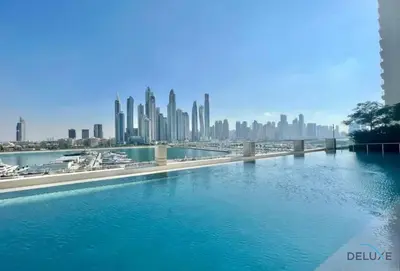 a river with a city in the background at Charming 1BR Apartment at Marina Vista Tower 2 Emaar Beachfront Dubai Marina by Deluxe Holiday Homes in Dubai