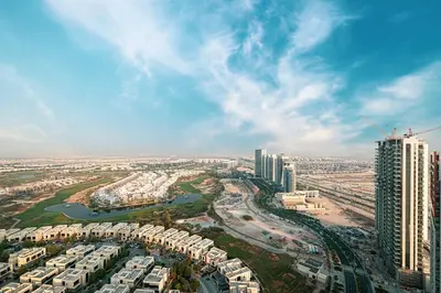 an aerial view of a city with tall buildings at SmartStay at Carson Tower - Panoramic City Views - Modern Luxury Apartments in Dubai