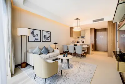 a living room with a couch and a table at CitiHome-2BR at Address Opera in the Heart of Downtown in Dubai