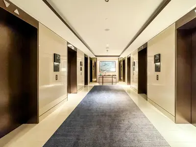 a hallway in a building with a carpet at CitiHome-2BR at Address Opera in the Heart of Downtown in Dubai