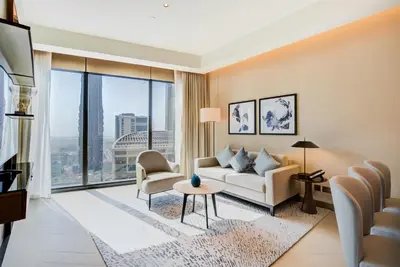 a living room with a couch and a table at CitiHome-2BR at Address Opera in the Heart of Downtown in Dubai