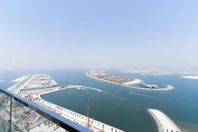 an aerial view of a bridge over a body of water at Luxury Sunrise Bay 1BR - Panoramic Sea View with Exclusive Amenities, by Think Realty in Dubai