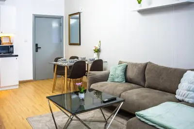 a living room with a couch and a table at Dubai marina - Luxury Studio Apartment in Dubai