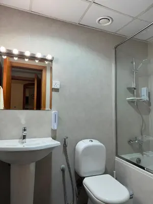 a bathroom with a toilet and a sink and a shower at Great Location in Dubai Marina!! in Dubai