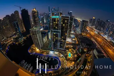 a view of a city at night with traffic at LUX The JW Marina Suite 2 in Dubai