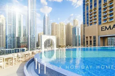 a large swimming pool on top of a city skyline at LUX The JW Marina Suite 2 in Dubai